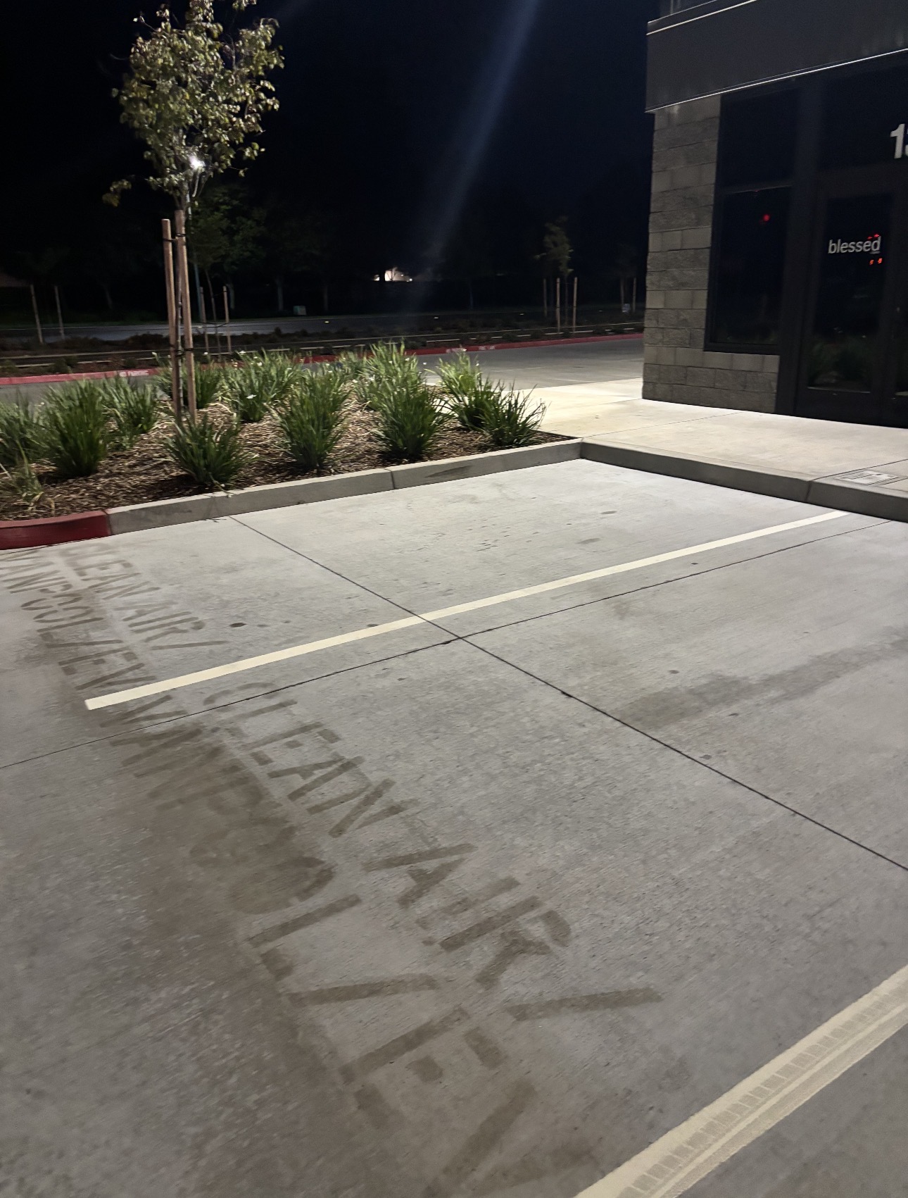 Before — Commercial parking lot before and after hot-water pressure washing in Sacramento